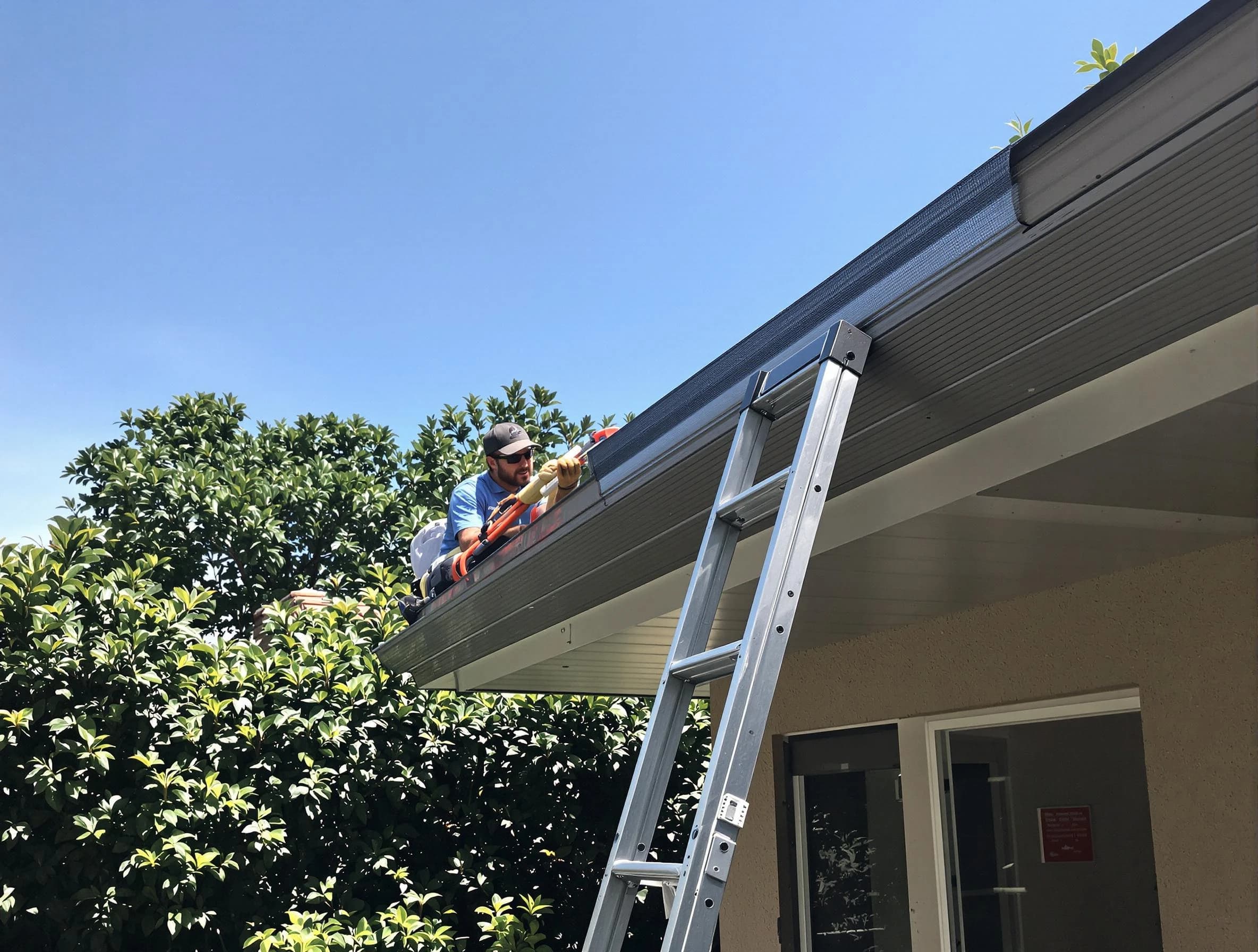 South Euclid Roofing Company installing gutter guards for a homeowner in South Euclid, OH